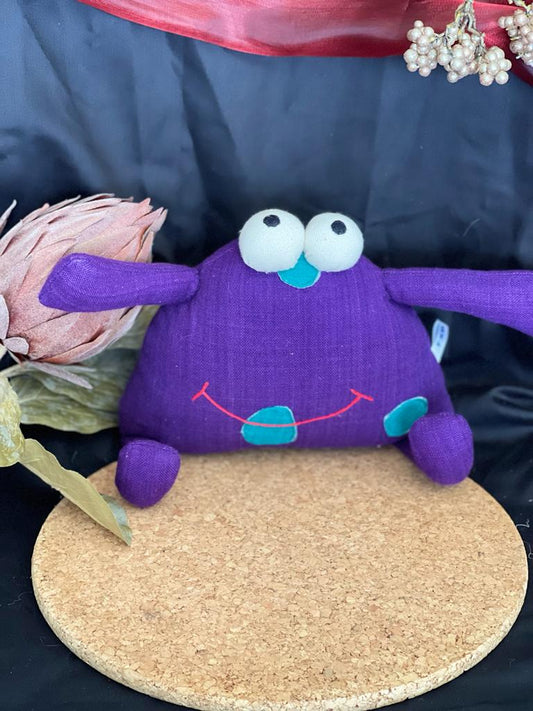 Coussin décoratif petit monstre